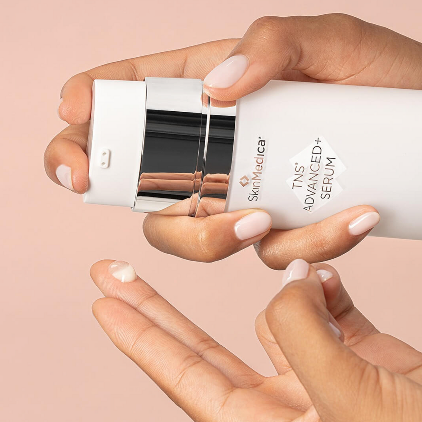 SkinMedica TNS Advanced+ Serum with cap removed, showing applicator pump